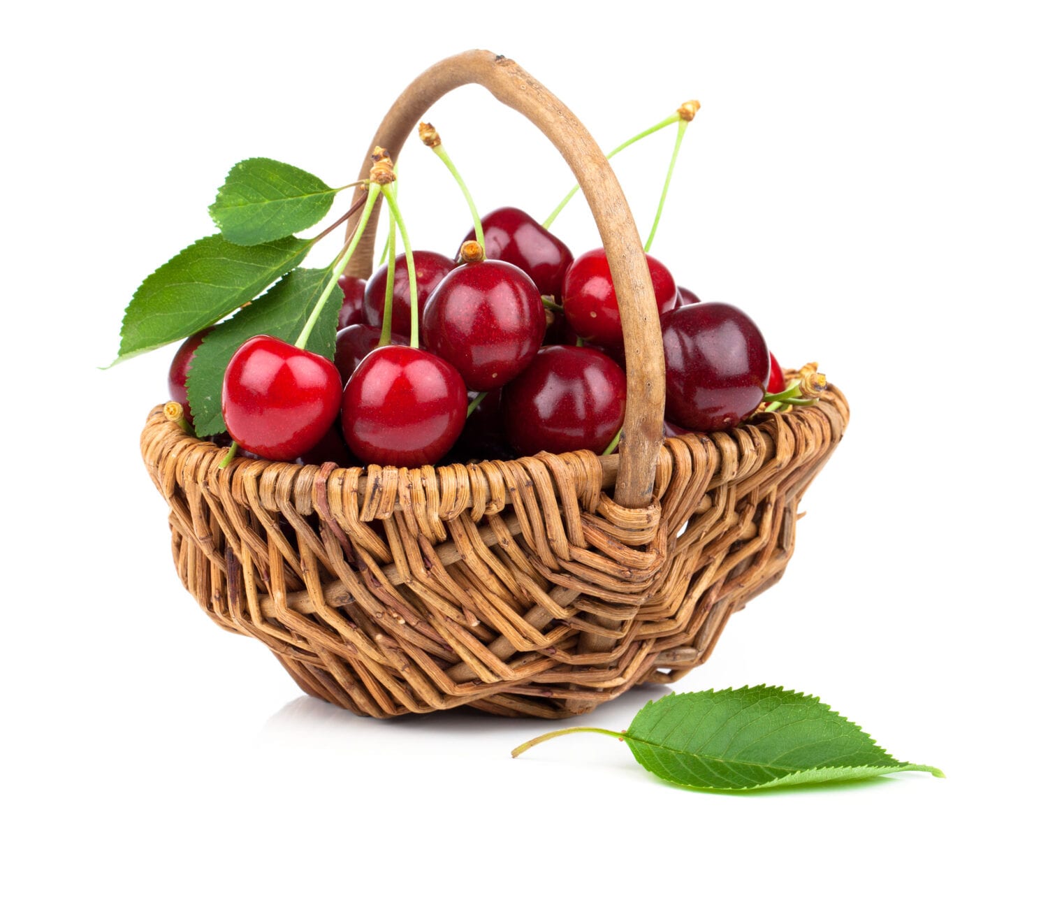 Basket full of fresh red cherry on a white background Basket full of fresh red cherry on a white background